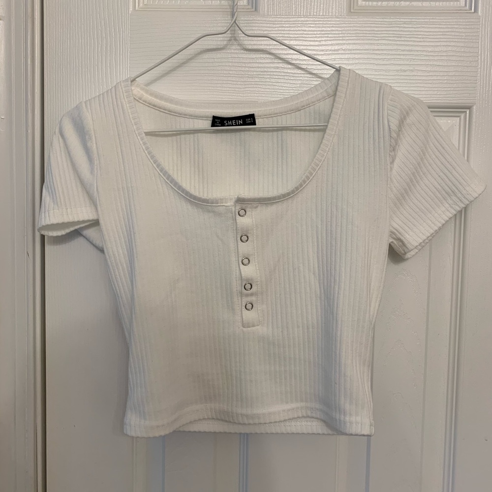 White quarter-button up top
